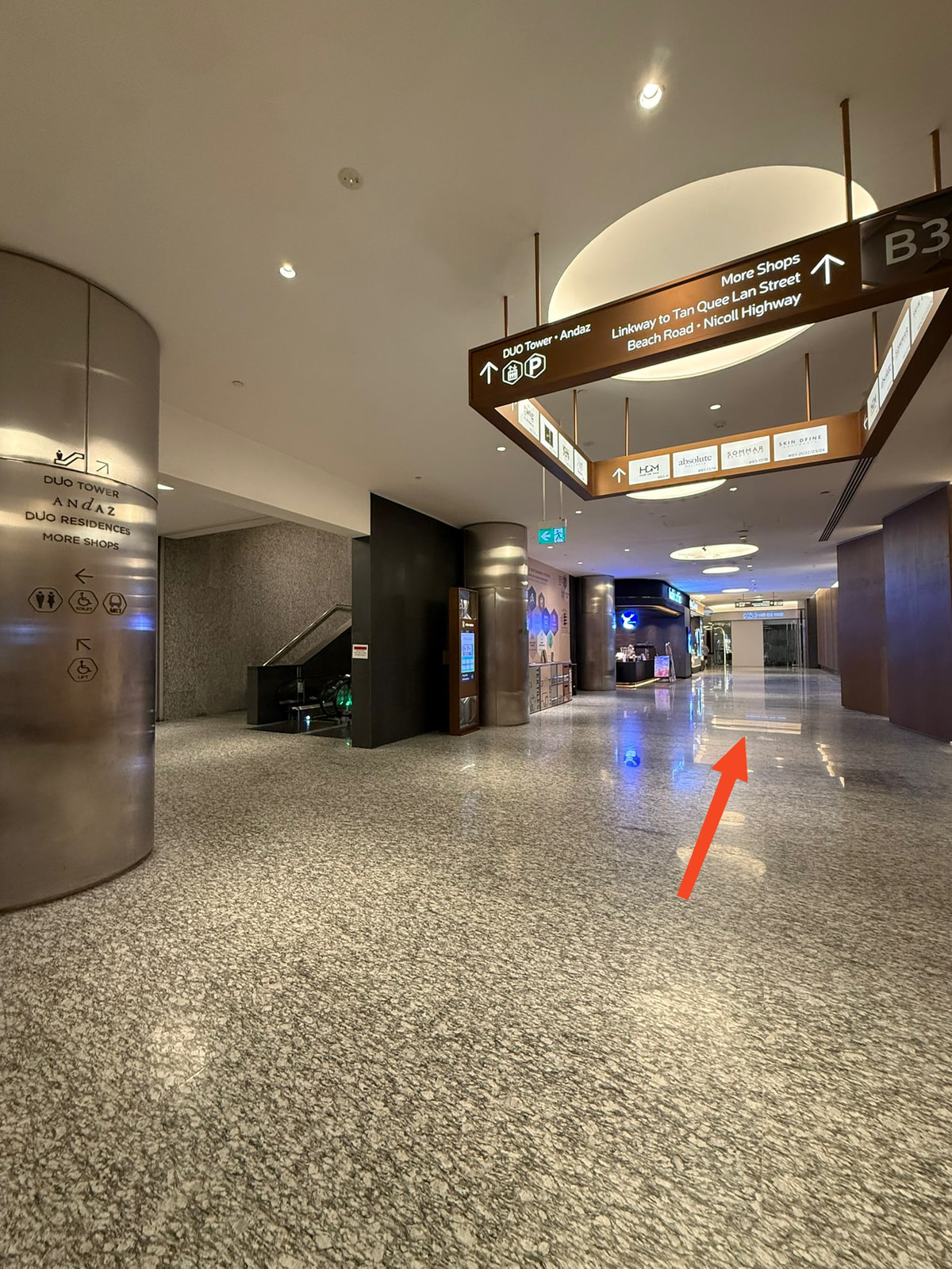 Do not go up the escalators! Continue straight past Luckin Coffee.